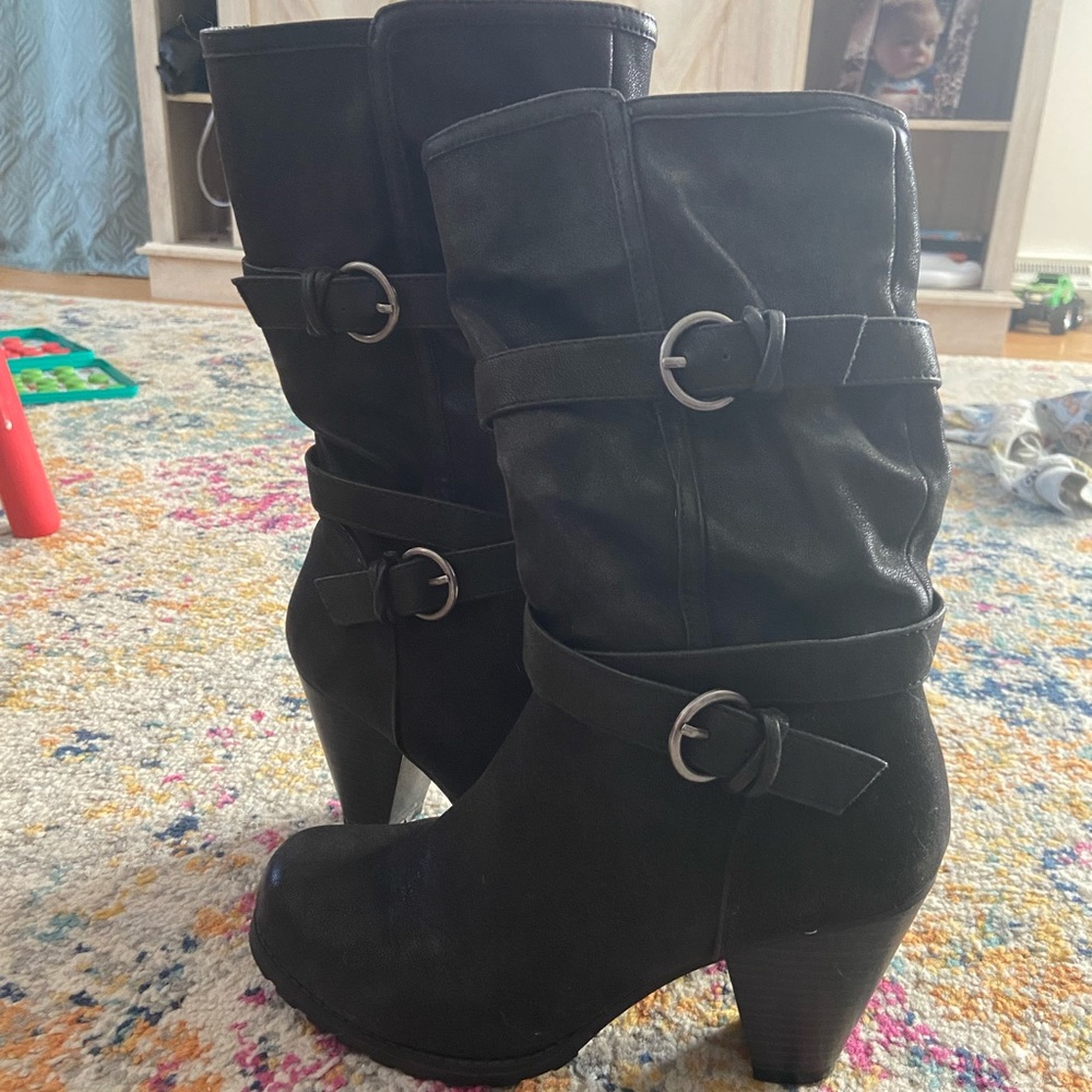 Black boots with buckle detail